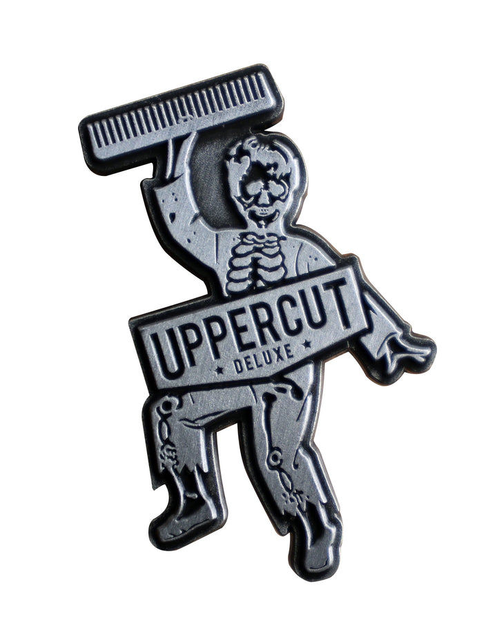 Uppercut Deluxe Skull Dust bonus lapel pin included with each retail tin